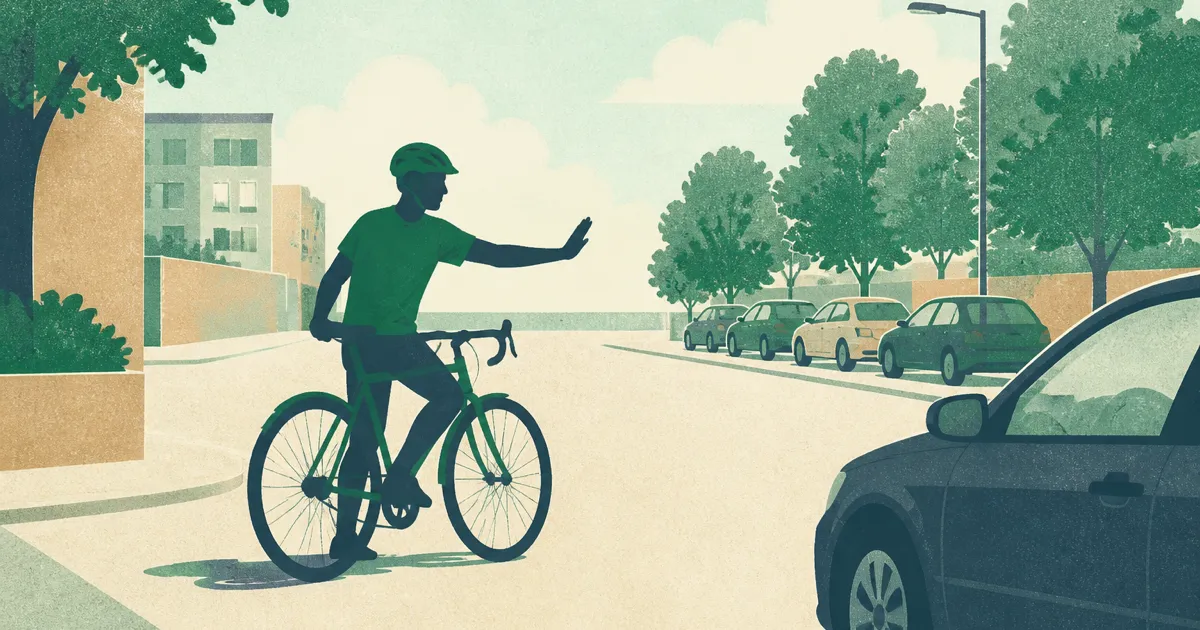 Cyclist giving way to pedestrians at a busy UK city junction